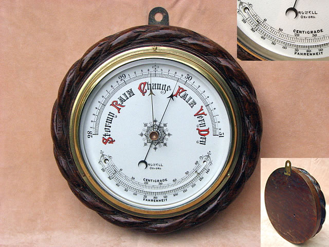 Marine barometer with curved thermometer, in ropetwist carved oak surround